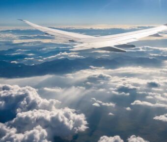 An airplane on flight among the clouds