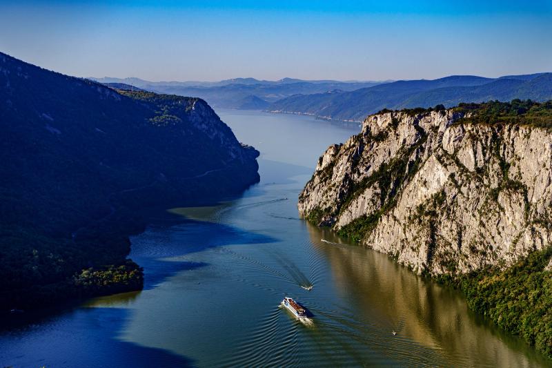 Aerial view of Danube river with sailboat passing