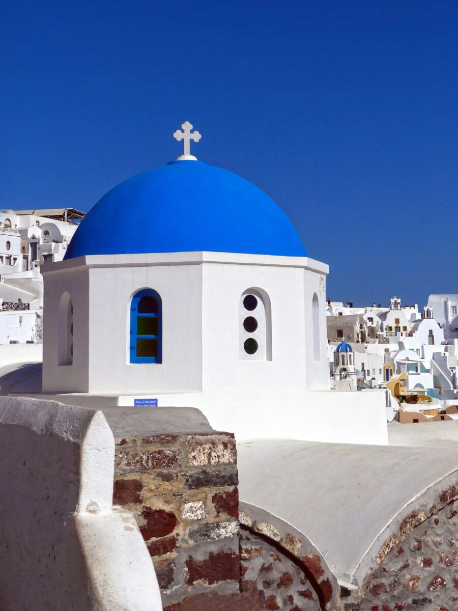 Iconic white and blue buildings in Akrotiri in Greece