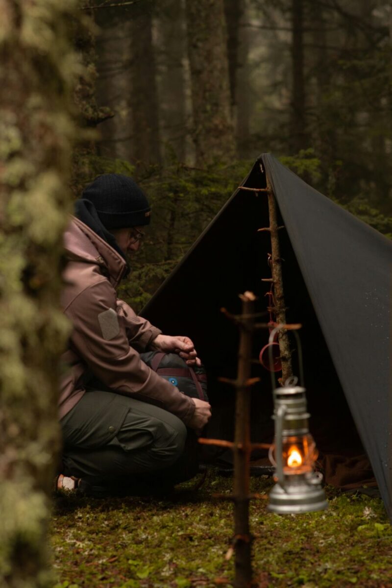 Man camping in the wild