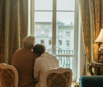 Couple sitting down looking out the window