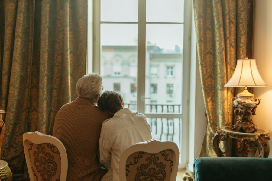 Couple sitting down looking out the window