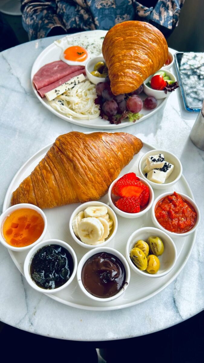 Croissant with several jams and dips