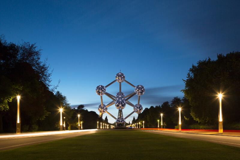 Evening lights trail past the iconic Atomium in Brussels