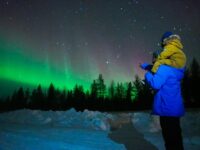 Tourists checking out Finland aurora borealis