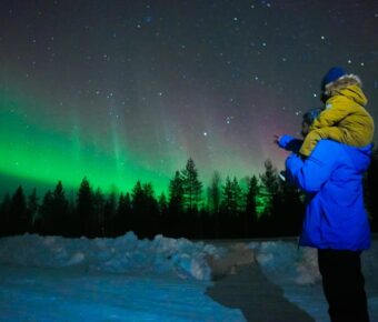 Tourists checking out Finland aurora borealis