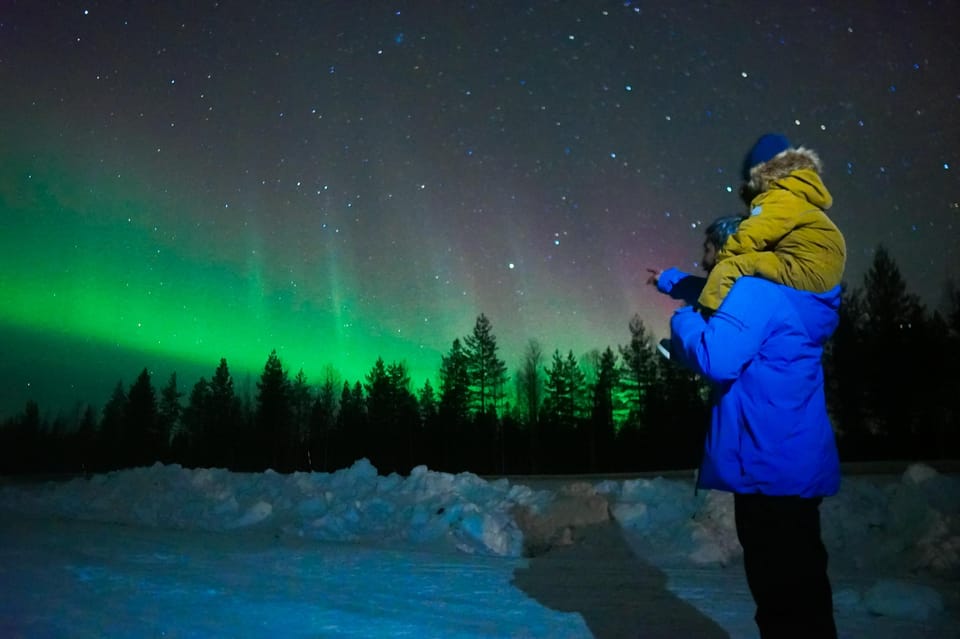 Tourists checking out Finland aurora borealis