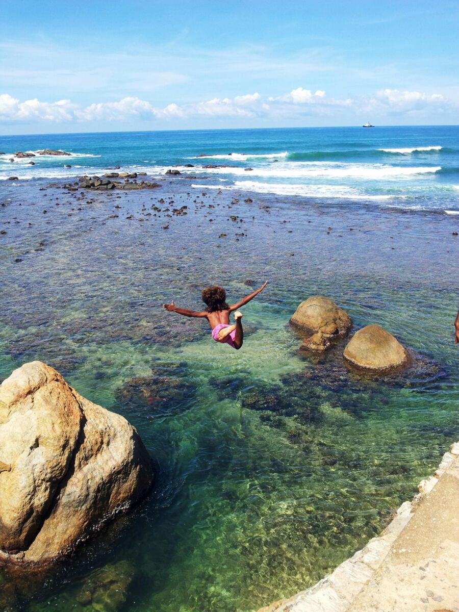 Kid cliff diving in Galle Sri Lanka