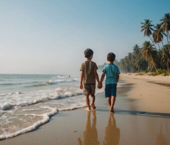 Brothers holding hands together by the beach