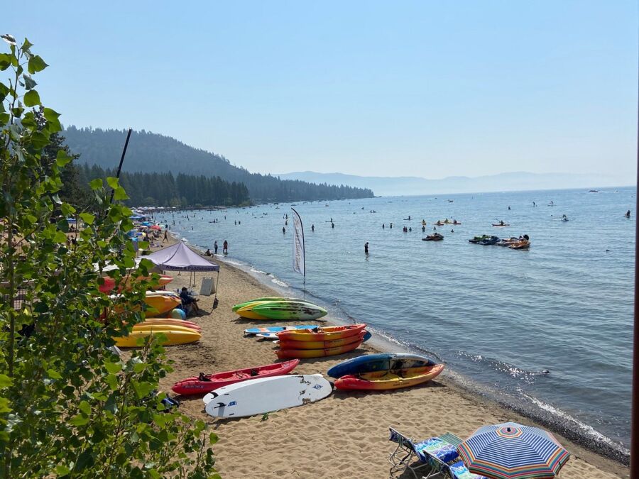 Kayaks lined at the shore of Kings Beach