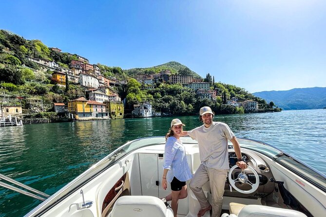 Couple tourist on a sailboat at Lezzeno