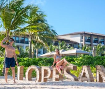 Couple picture taking at Lopesan signage