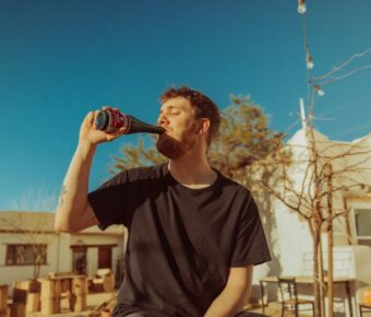 Man drinking beer outdoors