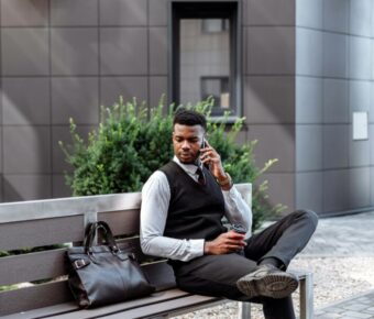 Man in a suit making a phone call