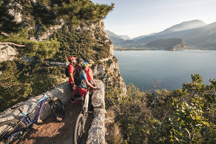 Bikers viewing the coastal waters at Nago-Torbole