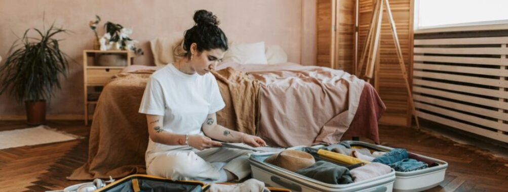 Woman packing suitcase