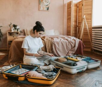 Woman packing suitcase