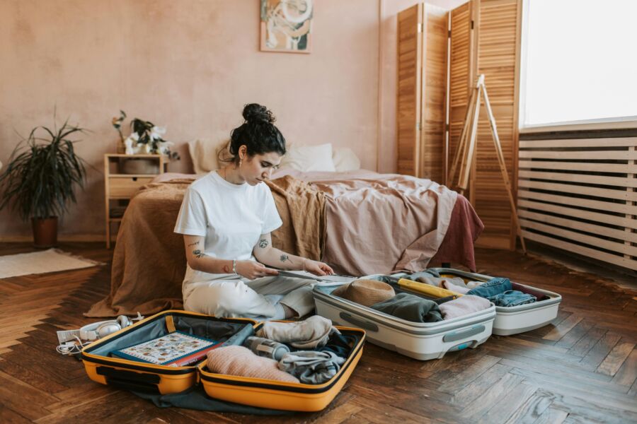 Woman packing suitcase