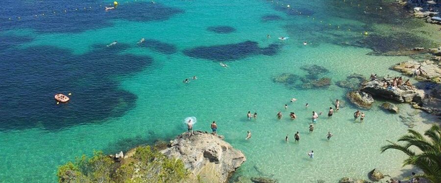 Beachgoers in Peguera