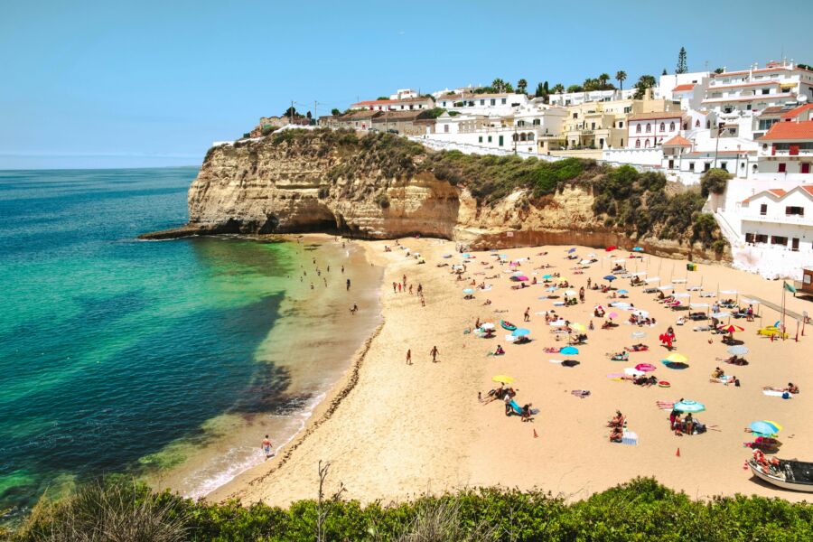 People at the beach in Sintra during summer