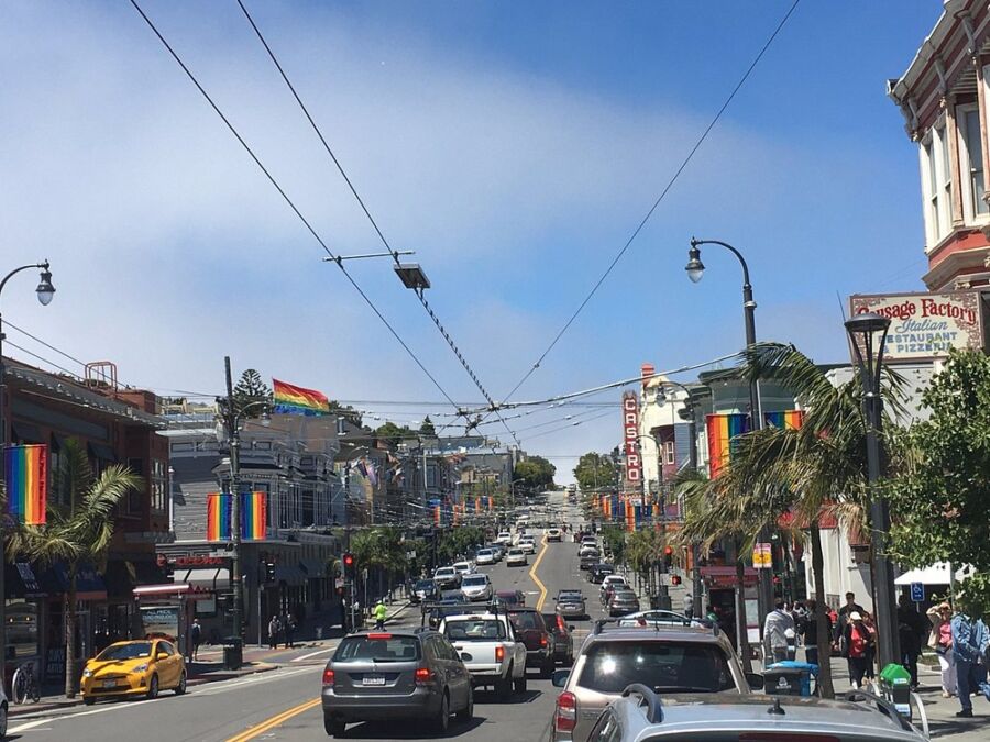 Colorful rainbow signs and flags around The Castro