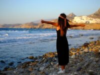 Woman in black enjoying the scenery in Naxos, Greece