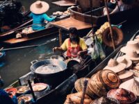 Woman selling on a boat in Bangkok