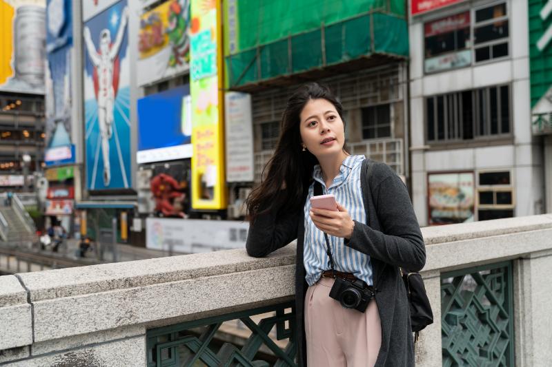 Woman tourist in Dotonbori