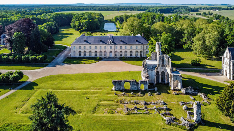 Aerial view of the Royal Abbey of Chaalis ruins and Jean Aubert's castle near Ermenonville, Oise, France.