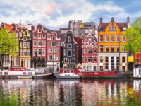 Amsterdam Netherlands dancing houses over river Amstel landmark