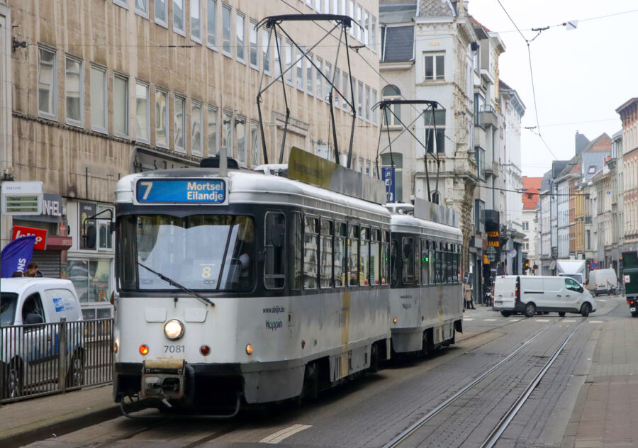 Vintage PCC trams of De Lijn navigate the streets of Antwerp, showcasing the city's rich transportation history