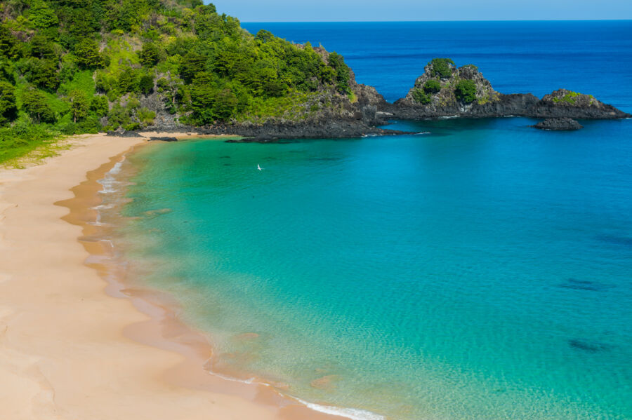 Panoramic view of Baía do Sancho, showcasing its stunning turquoise waters and lush green cliffs