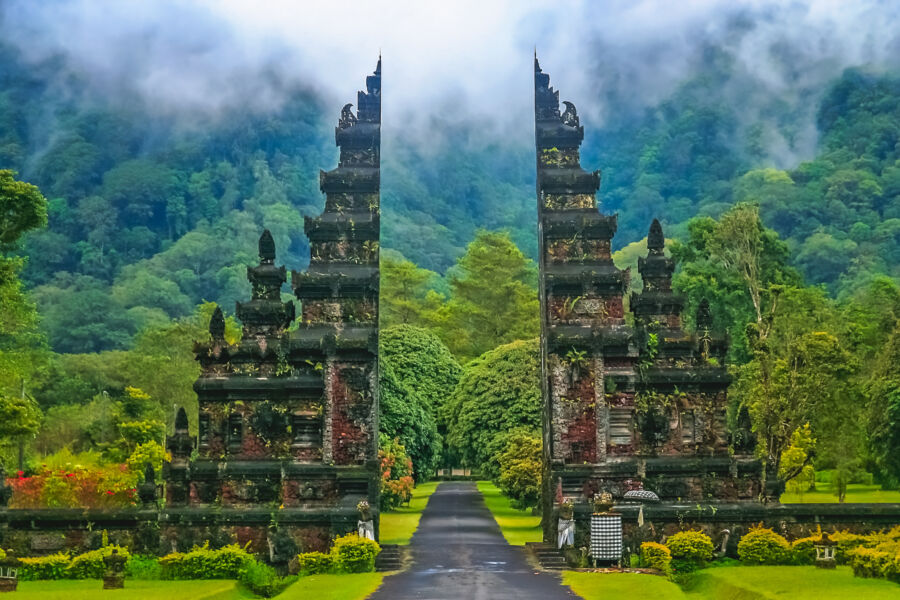 Beautiful gates of a Hindu temple in Bali, Indonesia, showcasing intricate carvings and vibrant colors