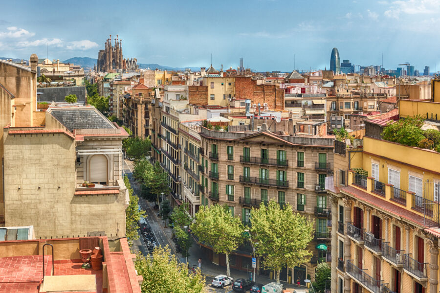 Aerial view showcasing the rooftops of central Barcelona, highlighting the unique architecture of Catalonia, Spain.