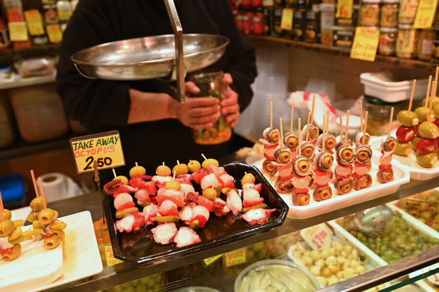 Vibrant La Boqueria market in Barcelona, showcasing fresh produce and tapas