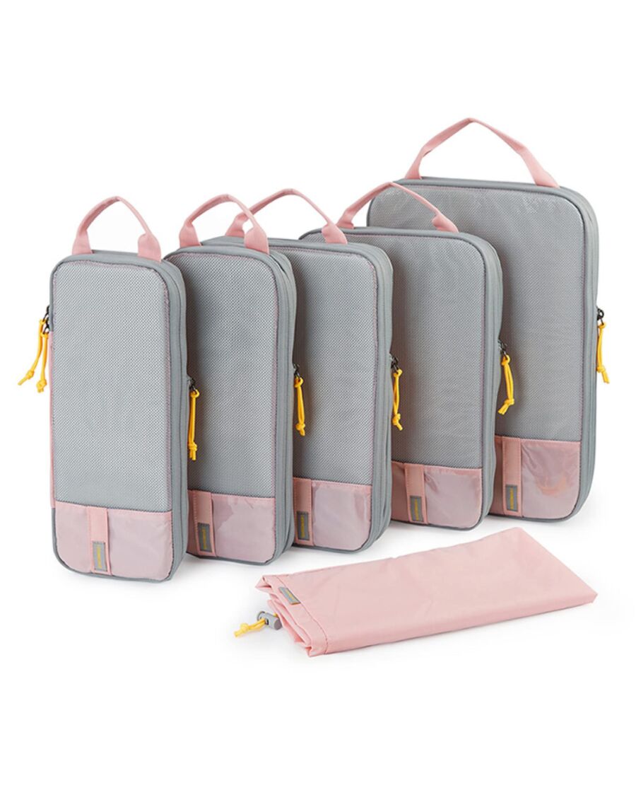 Gray and pink travel bags with yellow zippers; includes smaller pouch for organization.