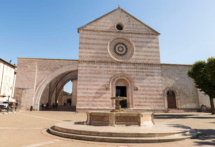 The Basilica of Saint Clare in Assisi, Italy, featuring stunning architecture and rich cultural heritage in a picturesque setting