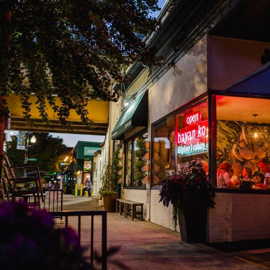 Exterior view of Bayan Ko Chicago, showcasing its vibrant sign and inviting atmosphere.