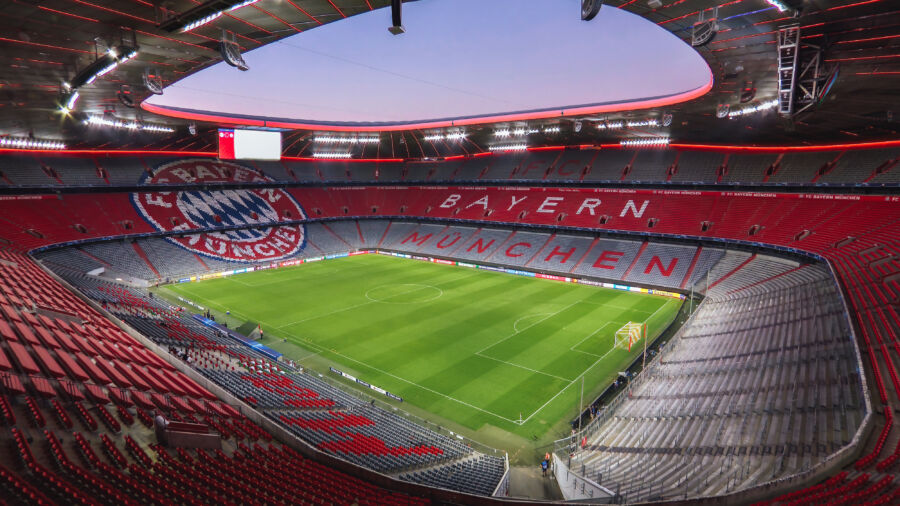 The Allianz Arena in Munich, Germany, featuring its distinctive glowing exterior, home to Bayern Munich football team