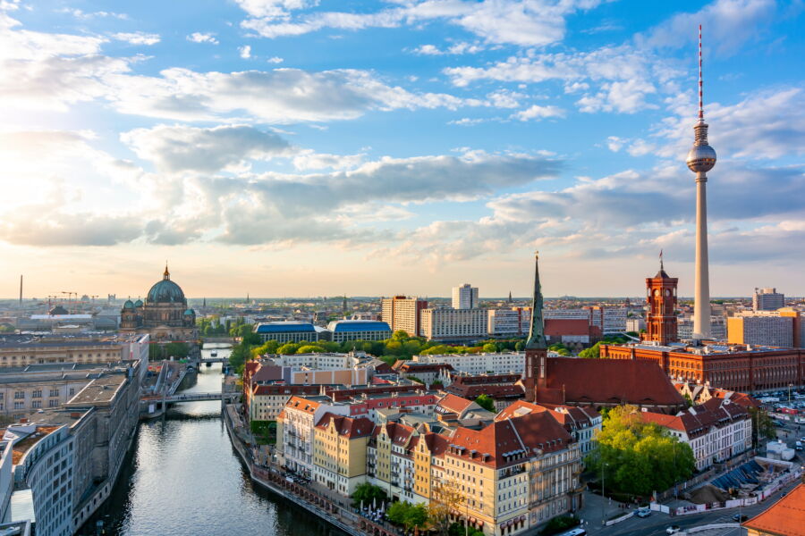 The Berlin city skyline showcasing the majestic Berlin Cathedral and the towering Television Tower amidst urban scenery