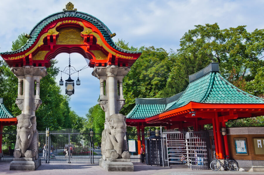 Entrance gate of Berlin Zoo, showcasing its distinctive architecture and welcoming visitors to the renowned wildlife park