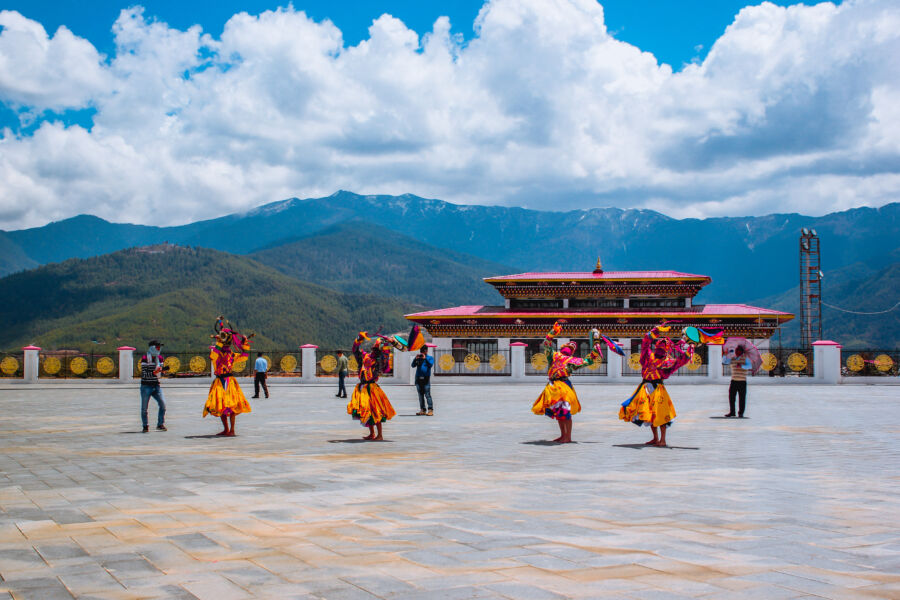 Close-up of traditional dance in Mongar, Bhutan, showcasing vibrant colors and intricate costumes