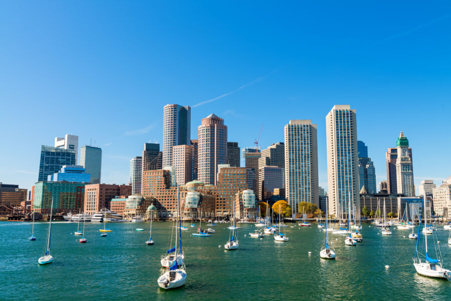 Boston's beautiful skyline rises above the harbor, highlighting the city's unique architecture and urban charm