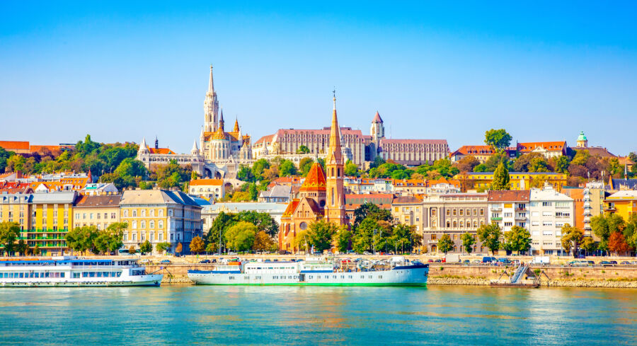 The skyline of Budapest showcasing the majestic Buda Castle alongside the tranquil waters of the Danube River