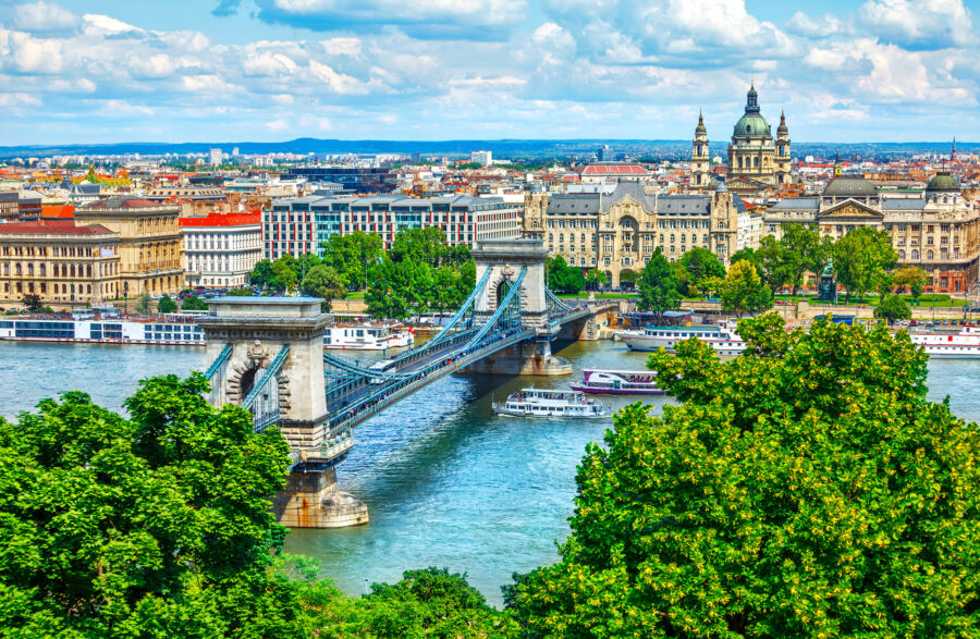 Chain bridge spanning the Danube River in Budapest, Hungary, showcasing the city's stunning skyline and architecture