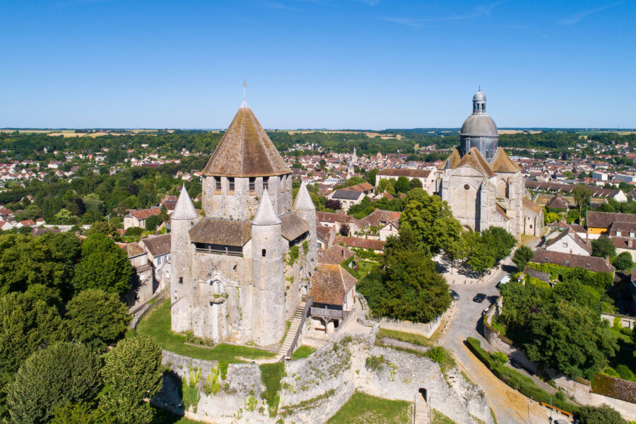 Stunning aerial shot of Caesar's Tower in Provins, France, highlighting its impressive structure and scenic surroundings