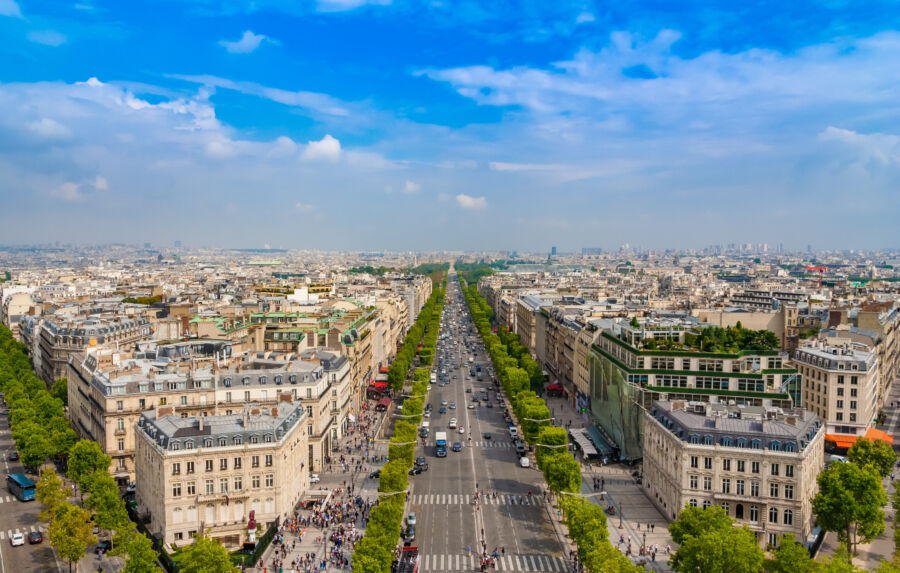 Aerial view of the iconic Avenue des Champs-Élysées in Paris, showcasing its vibrant atmosphere and beautiful architecture