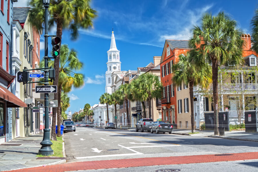 St. Michaels Church on Broad St. in Charleston, South Carolina, features classic architecture amidst a vibrant city scene