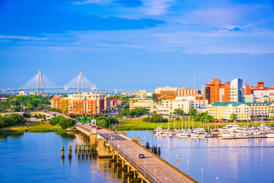 Aerial view of Charleston, South Carolina, showcasing historic buildings, lush greenery, and the waterfront