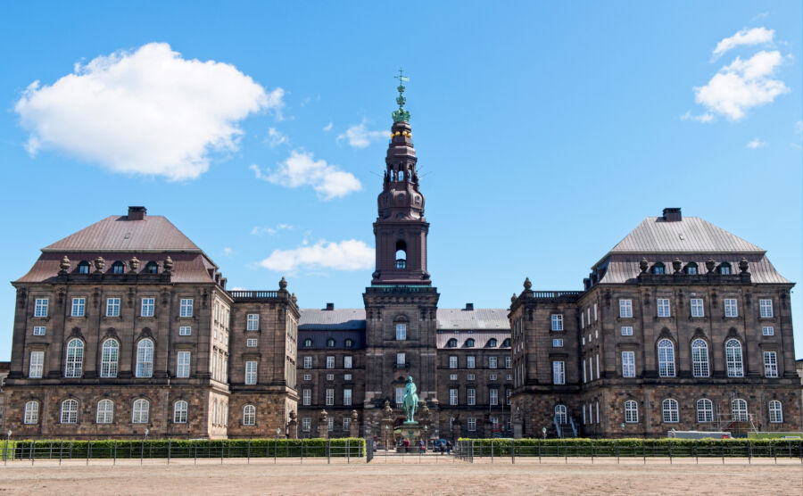 Exterior view of Christiansborg Palace in Copenhagen, showcasing its grand architecture and historical significance